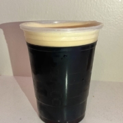 Realistic iced coffee topped with a creamy layer of cold foam